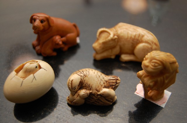 Appraisal: A COLLECTION OF JAPANESE IVORY AND BOXWOOD NETSUKE Comprising four