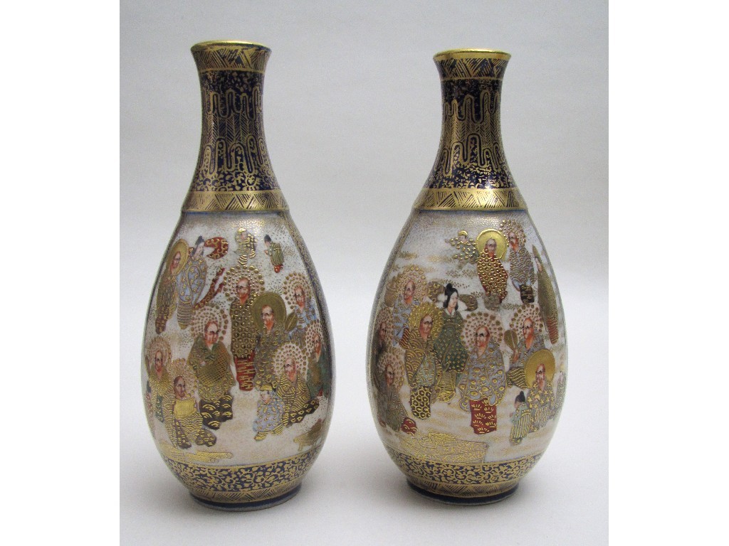 Appraisal: A pair of Satsuma bottle shaped vases painted with panels