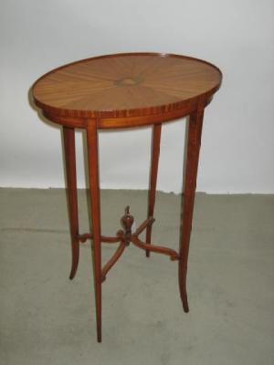 Appraisal: AN EDWARDIAN SATINWOOD WINE TABLE of oval form the galleried