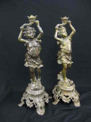 Appraisal: Pair of Bronzed Figural Candlesticks childholding a cornucopia '' tall