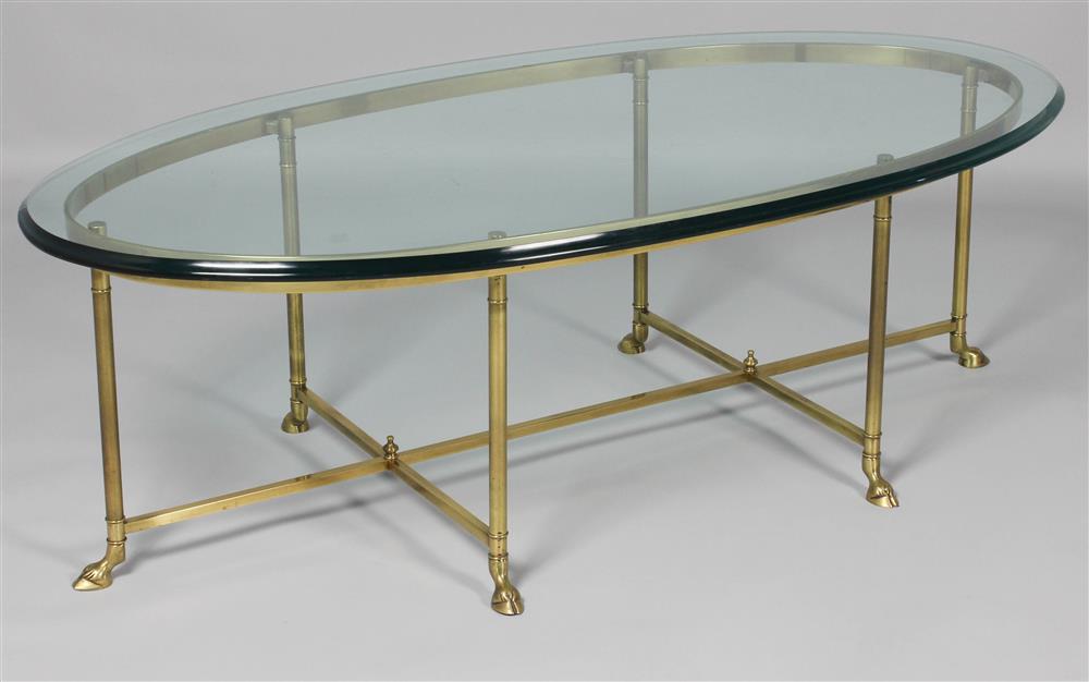 Appraisal: GLASS AND BRASS OVAL COFFEE TABLE the oval glass top