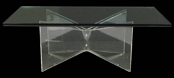 Appraisal: An acrylic and rectangular glass coffee table height in width