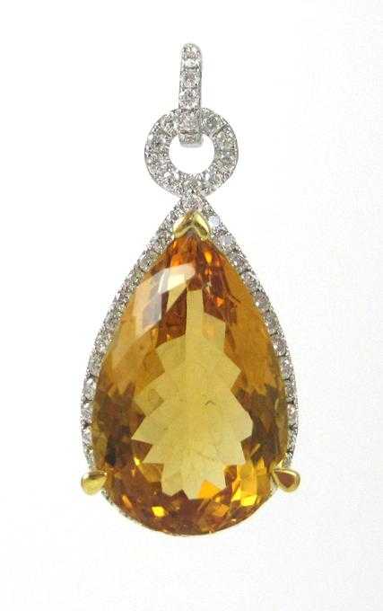 Appraisal: CITRINE DIAMOND AND FOURTEEN KARAT GOLD PENDANT with round-cut diamonds