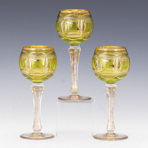 Appraisal: THREE MOSER WINE GOBLETS CHARTREUSE GLASS WITH GILT DESIGN Substantial