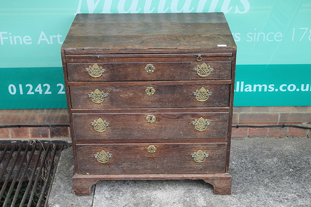 Appraisal: A GEORGE III SMALL OAK CHEST of four graduated drawers