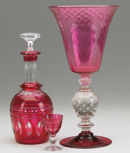 Appraisal: RUBY GLASS Seventeen pieces includes a decanter with fifteen liqueur