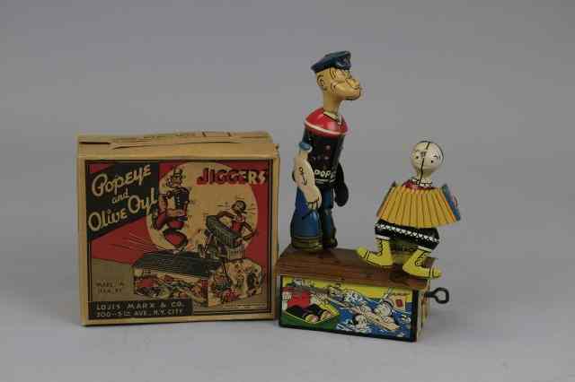 Appraisal: POPEYE AND OLIVE OYL JIGGERS WITH ORIGINAL BOX Louis Marx