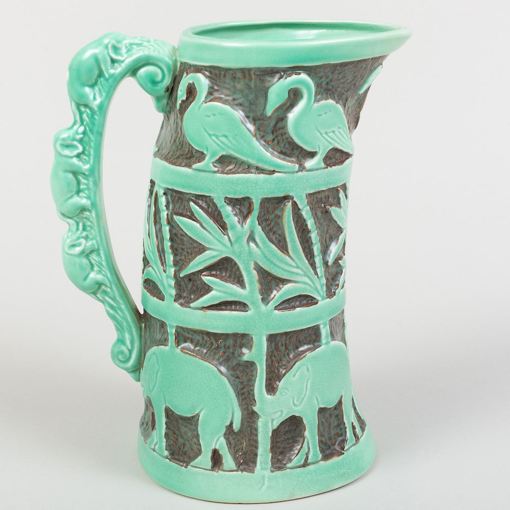 Appraisal: Burleigh Ware Tusk Shaped Jug Moulded with Elephants Birds and