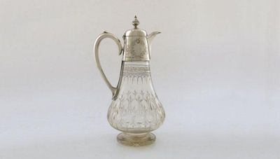 Appraisal: A Victorian electroplated mounted cut glass claret jug tapering circular