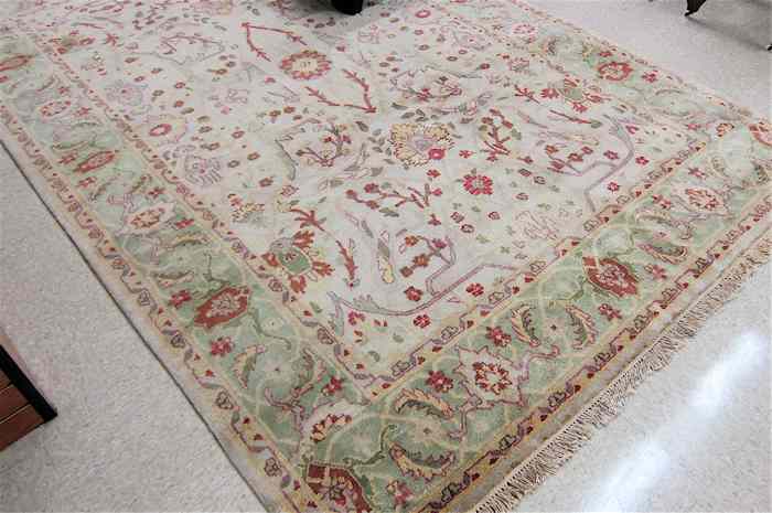 Appraisal: HAND KNOTTED ORIENTAL CARPET Indo-Persian having a floral decorated tan