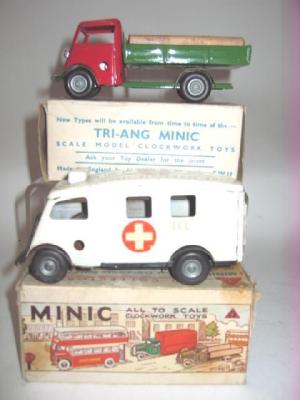 Appraisal: Two Minic clockwork toys short bonnet ambulance long lorry in