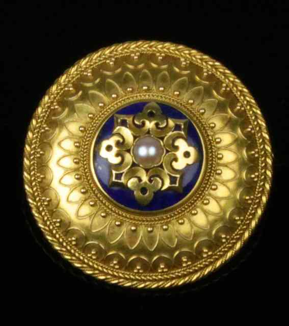 Appraisal: A Victorian target brooch centred by a split pearl and