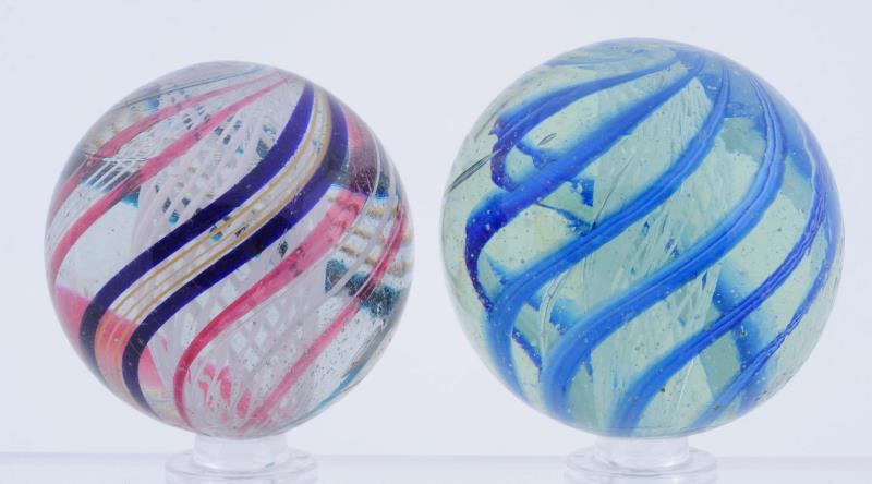 Appraisal: Lot Of Large Latticino Swirl Marbles The smaller has a