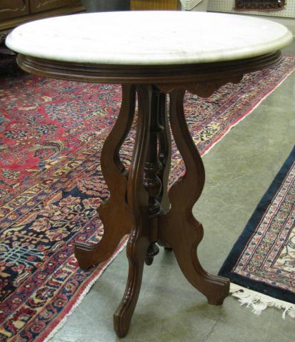 Appraisal: Victorian marble top oval lamp table walnut frame with carved