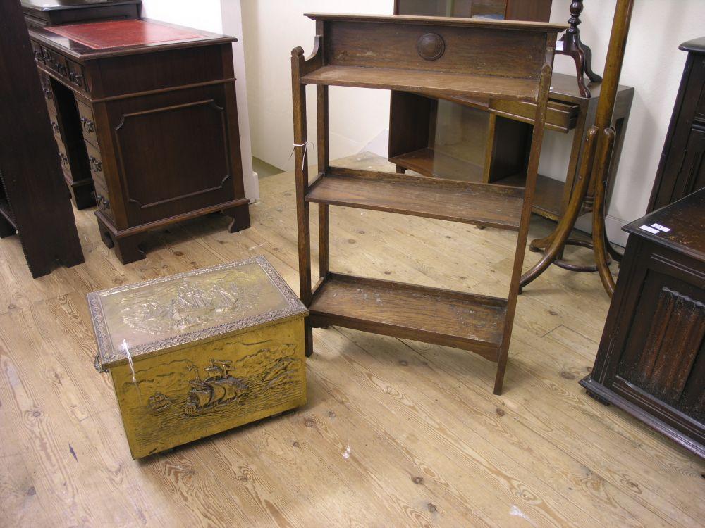 Appraisal: An oak open fronted bookcase ft in and an embossed