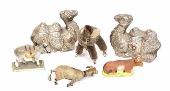 Appraisal: A selection of animal objects including the donkey statue as