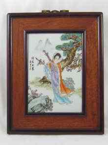 Appraisal: A Chinese porcelain plaque of a female musician in wooden