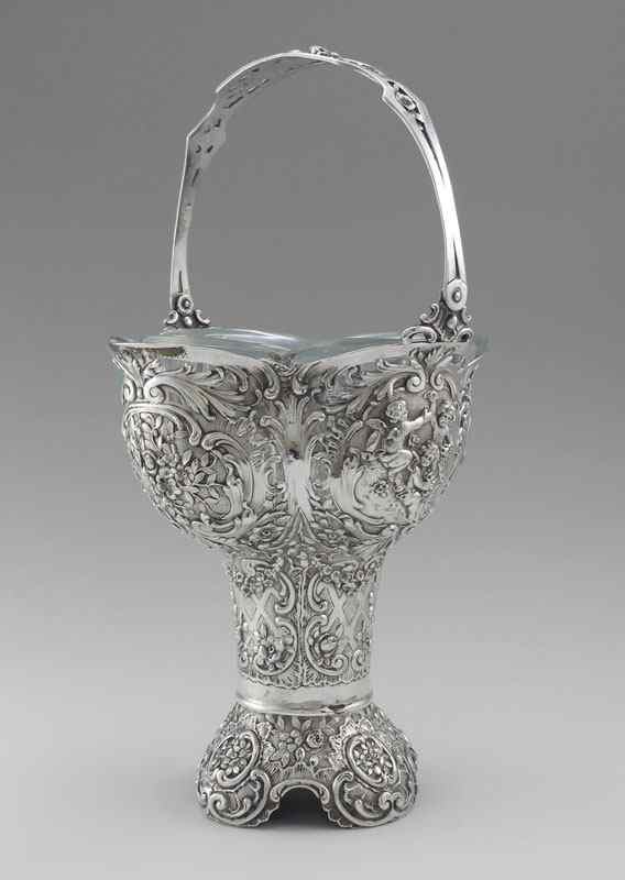 Appraisal: WEINRANCK SCHMIDT HANAU SILVER HANDLED BASKET Repousse continental silver handled