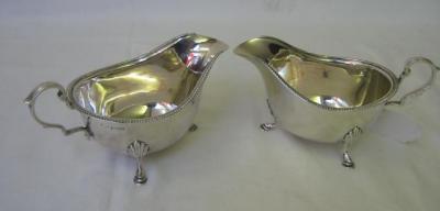 Appraisal: A PAIR OF SAUCE BOATS of oval bellied form with