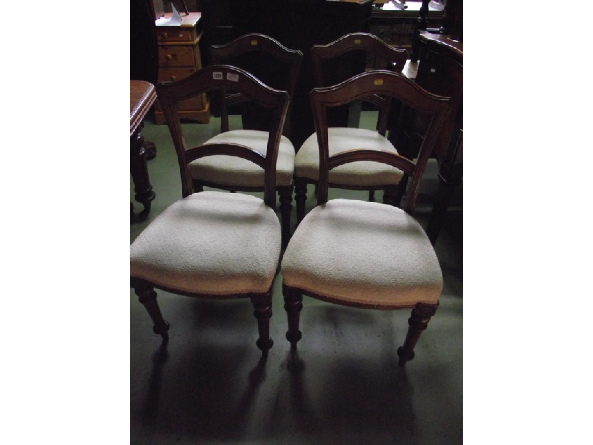 Appraisal: A set of four Victorian walnut dining chairs with arched