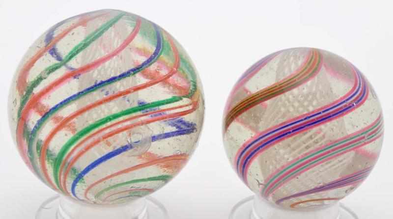 Appraisal: Lot of Large Latticino Swirl Marbles Description The larger marble