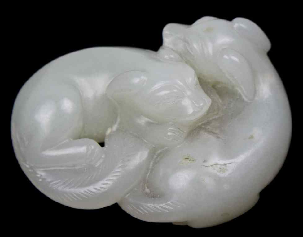 Appraisal: CHINESE WHITE JADE CARVING OF A PAIR OF PUPPIES the