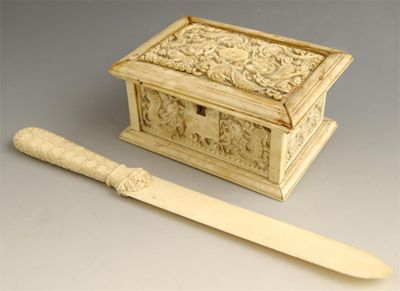 Appraisal: An oriental carved bone box decorated dragons amidst clouds the