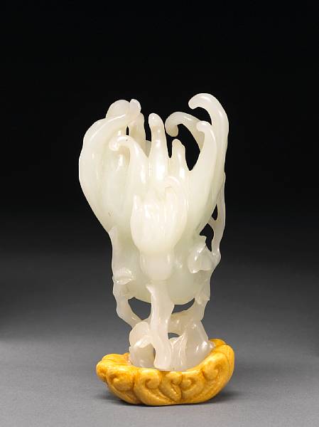 Appraisal: A white jade carving of a Buddha's hand citron Including