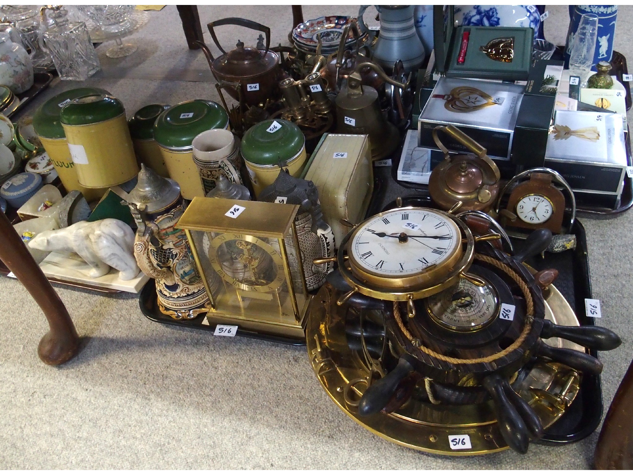 Appraisal: Storage tins ships wheel clocks and barometers assorted metalware including