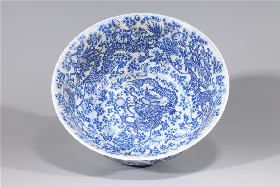 Appraisal: Large Chinese blue and white porcelain bowl with numerous dragons