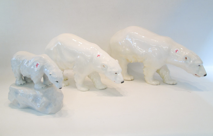 Appraisal: THREE CZECHOSLOVAKIAN WHITE GLAZED POTTERY BEARS the first smaller bear