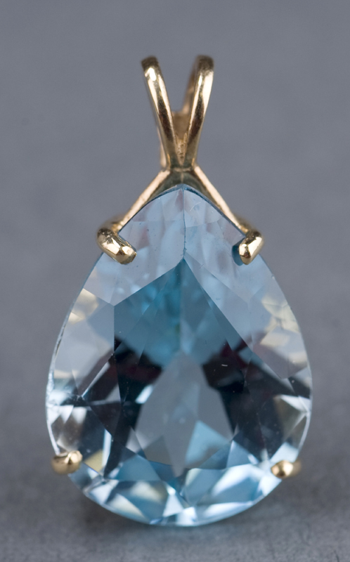 Appraisal: kt yellow gold swiss blue topaz pear shaped pendant Measuring