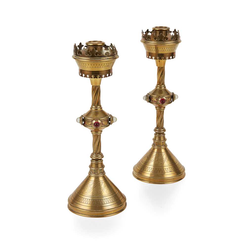 Appraisal: ENGLISH PAIR OF GOTHIC REVIVAL CANDLESTICKS CIRCA brass set with