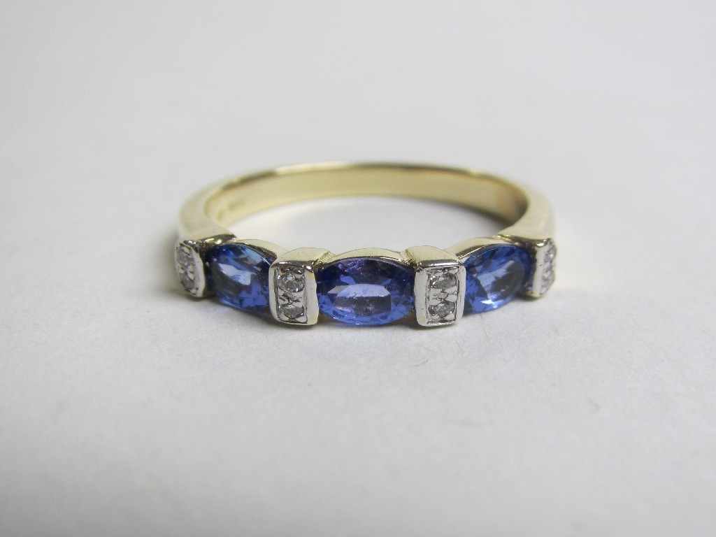 Appraisal: Fourteen carat gold tanzanite and diamond set dress ring