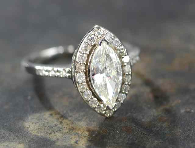 Appraisal: DIAMOND AND EIGHTEEN KARAT GOLD RING featuring a marquise-cut diamond