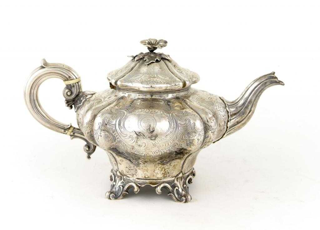 Appraisal: A VICTORIAN TEAPOT of melon type engraved with flowers and