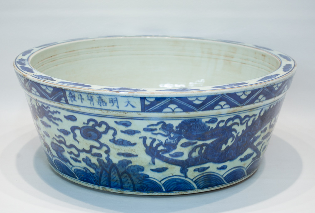 Appraisal: CHINESE BLUE AND WHITE PORCELAIN BASIN with hand painted dragon