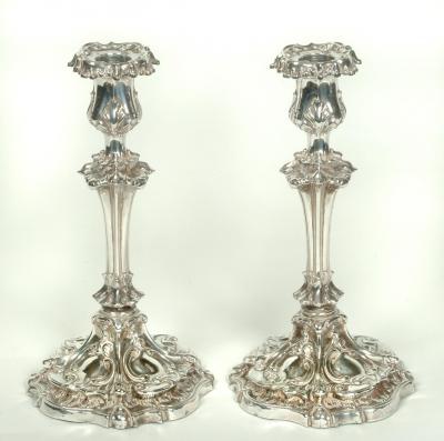 Appraisal: A PAIR OF VICTORIAN CANDLESTICKS Sheffield with leaf moulded urn