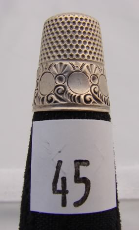 Appraisal: Sterling KMD thimble with circle designs on band