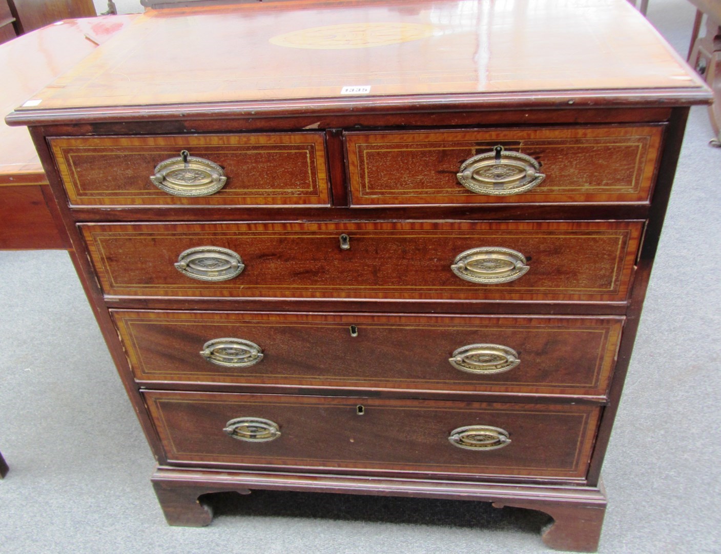 Appraisal: A small th century satinwood banded inlaid mahogany chest of