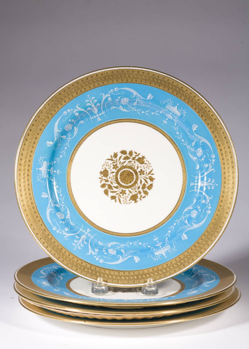 Appraisal: FOUR MINTON SERVICE PLATES WITH BLUE GROUND AND PAT-SUR-PAT DECORATION