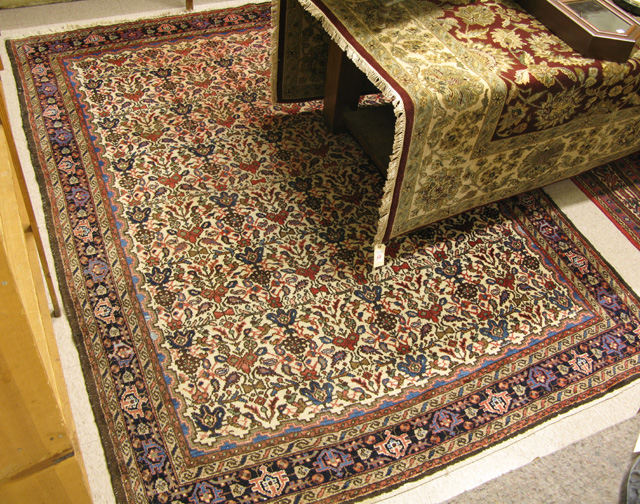 Appraisal: SEMI-ANTIQUE PERSIAN HAMADAN CARPET overall floral decoration on ivory ground