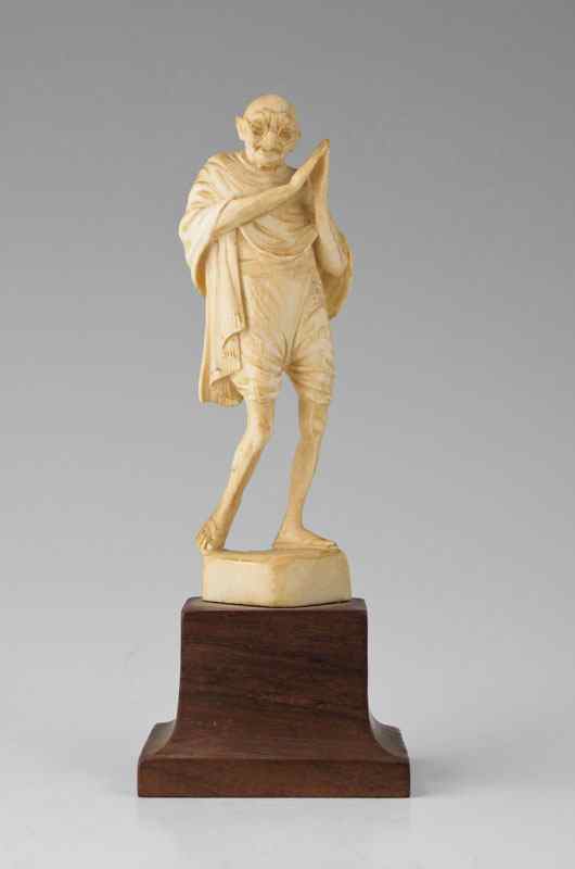 Appraisal: CARVED IVORY FIGURE OF MAHATMA GANDHI Figure of Gandhi measures