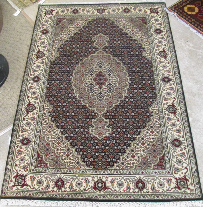 Appraisal: HAND KNOTTED ORIENTAL AREA RUG Persian Bidjar design central medallion