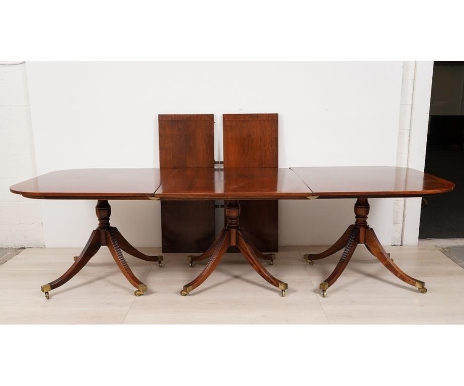 Appraisal: Three-part mahogany banquet table th c with two extra leaves