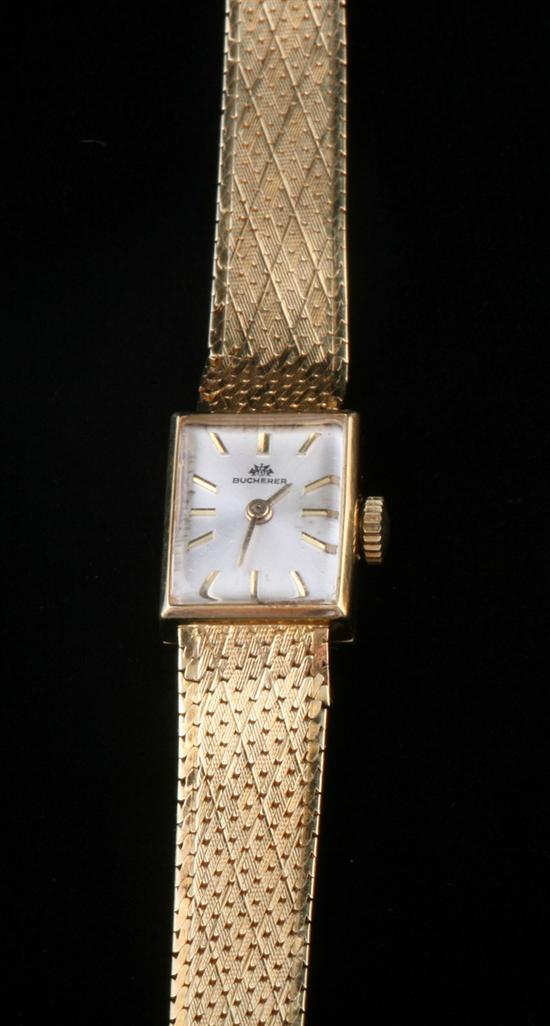 Appraisal: LADY'S K YELLOW GOLD WRISTWATCH By Bucherer Bright-polished rectangular case