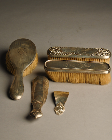 Appraisal: A Sterling Back Dresser Set three brushes and two shoe