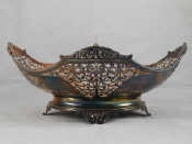 Appraisal: A pierced oval silver centrepiece bowl with shaped reeded and