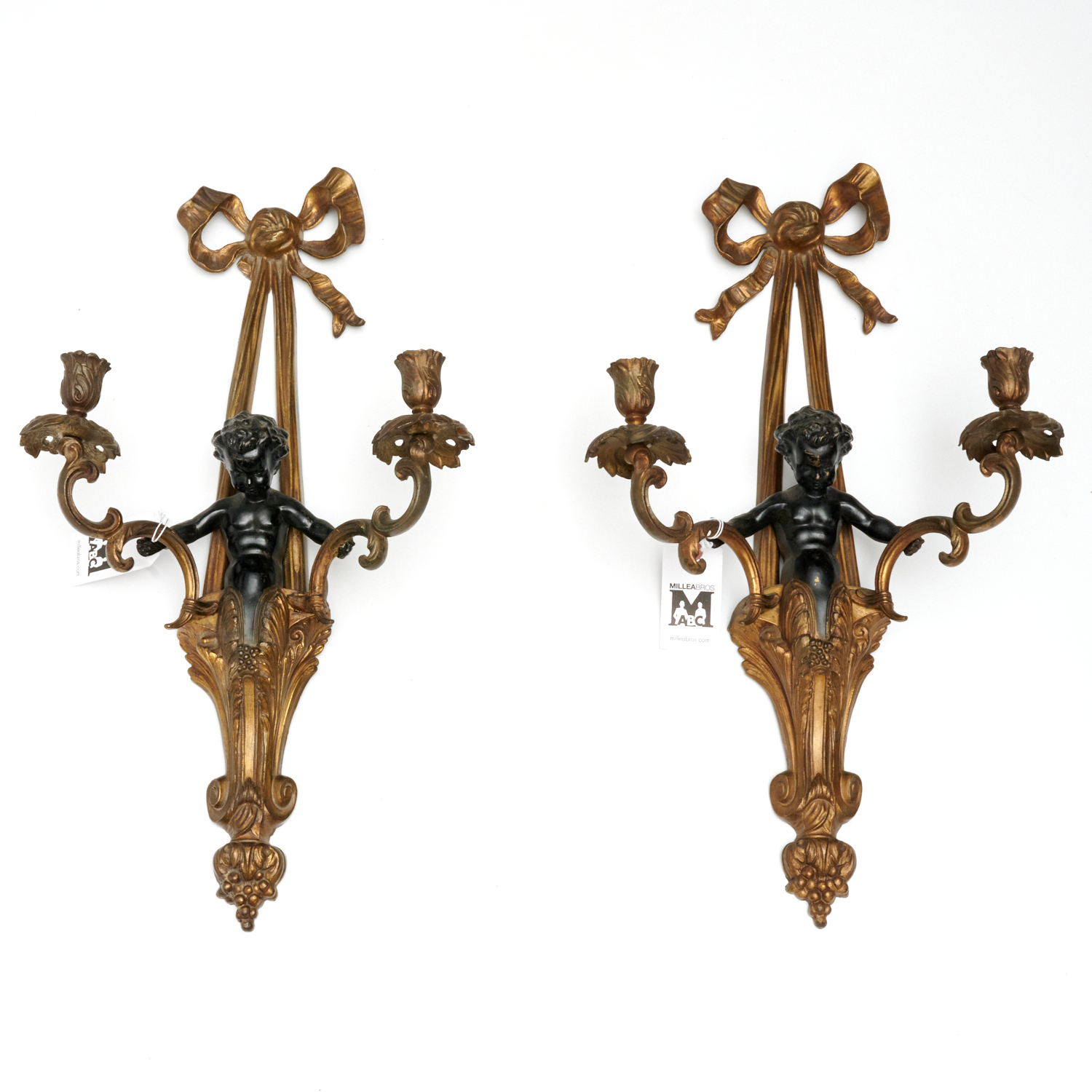 Appraisal: PAIR LOUIS XVI STYLE GILT METAL SCONCES th c two-arm