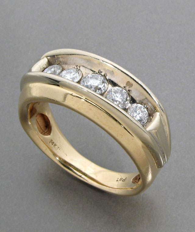 Appraisal: MAN'S DIAMOND AND FOURTEEN KARAT YELLOW AND WHITE GOLD RING